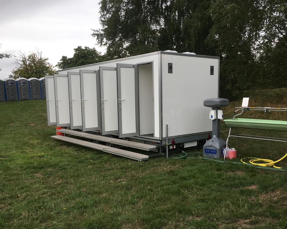 6-Bay Shower Units | Blue Loos Event Hire | Cheshire